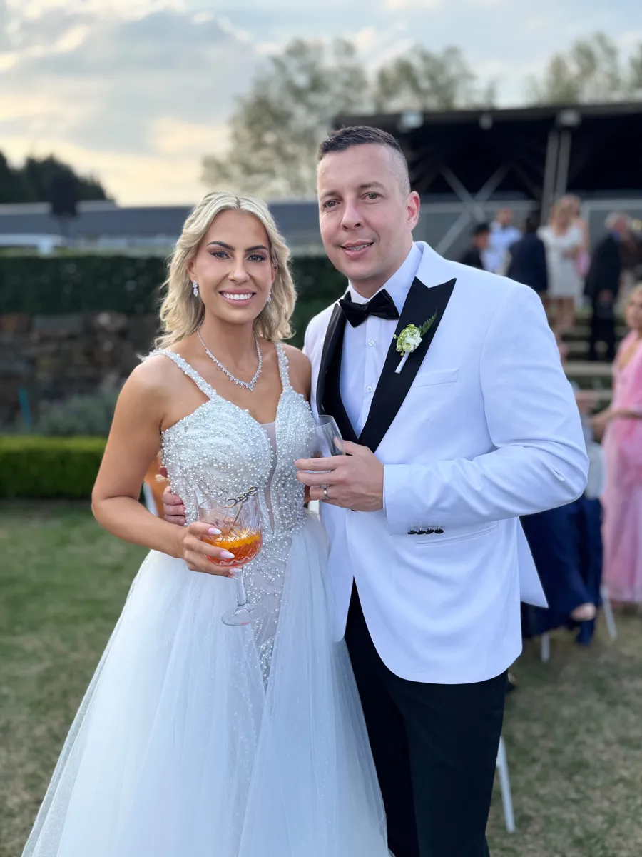 A bride and groom's raw phone photo from a KZN wedding, before PhotoPrint LAB's instant AI enhancement