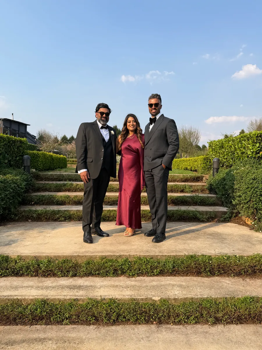 A raw phone photo of guests at a KZN corporate event, before PhotoPrint LAB's instant AI enhancement