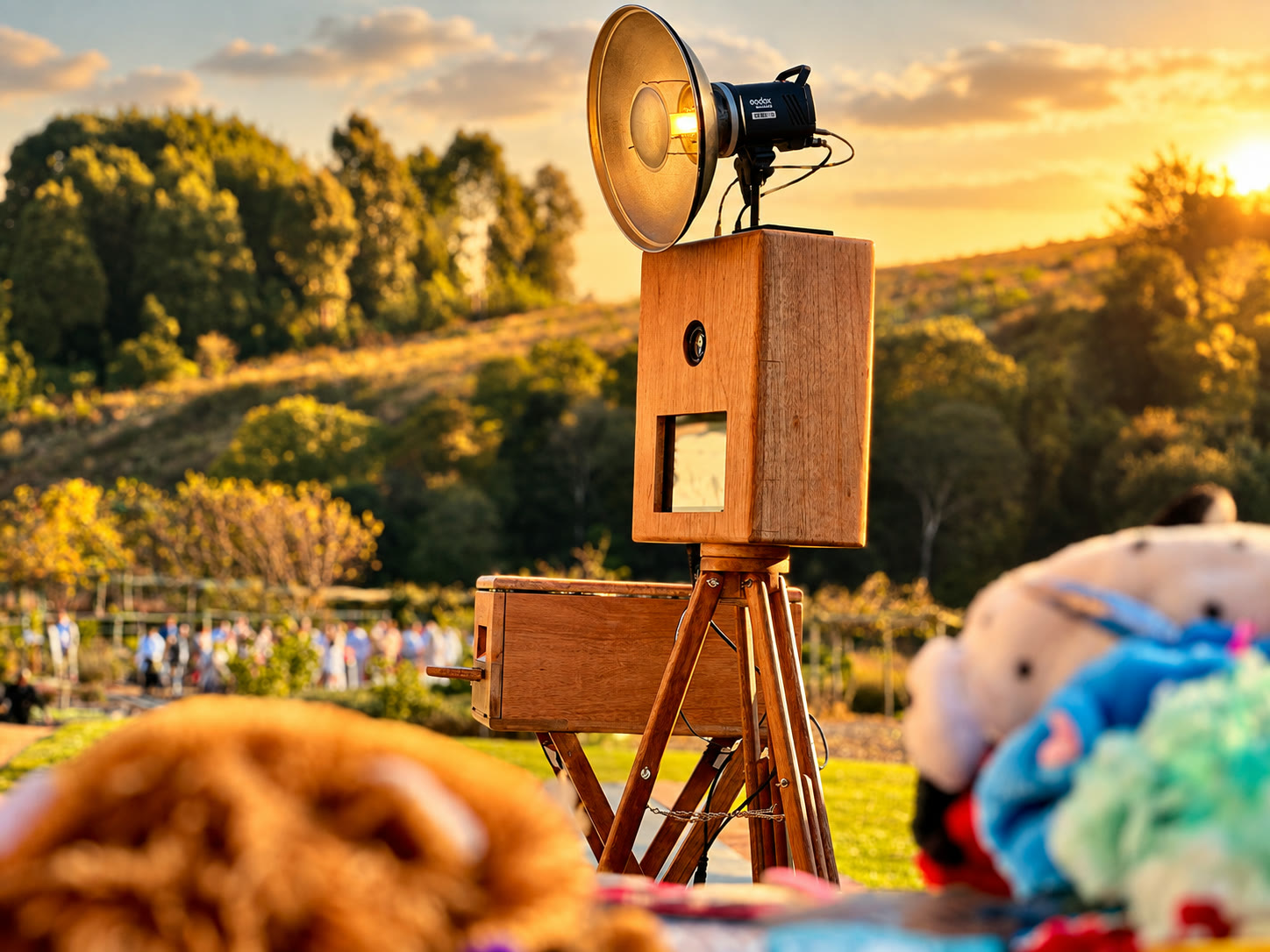 The wooden retro photobooth on its tripod at golden hour at a KZN Midlands wedding venue