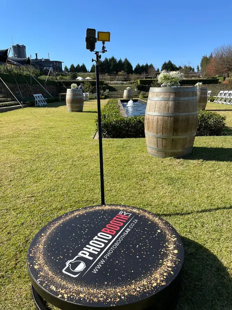 The SPIN360 videobooth platform set up on the lawn at Brahman Hills beside wine barrels