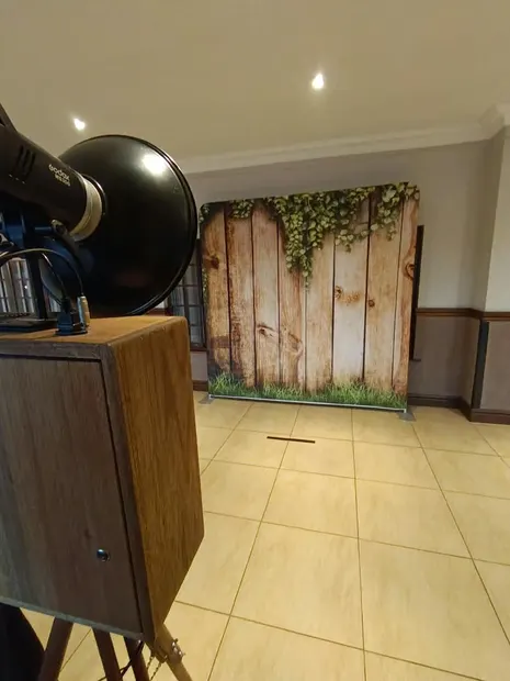 The retro photobooth facing the timber backdrop at Champagne Sports Resort