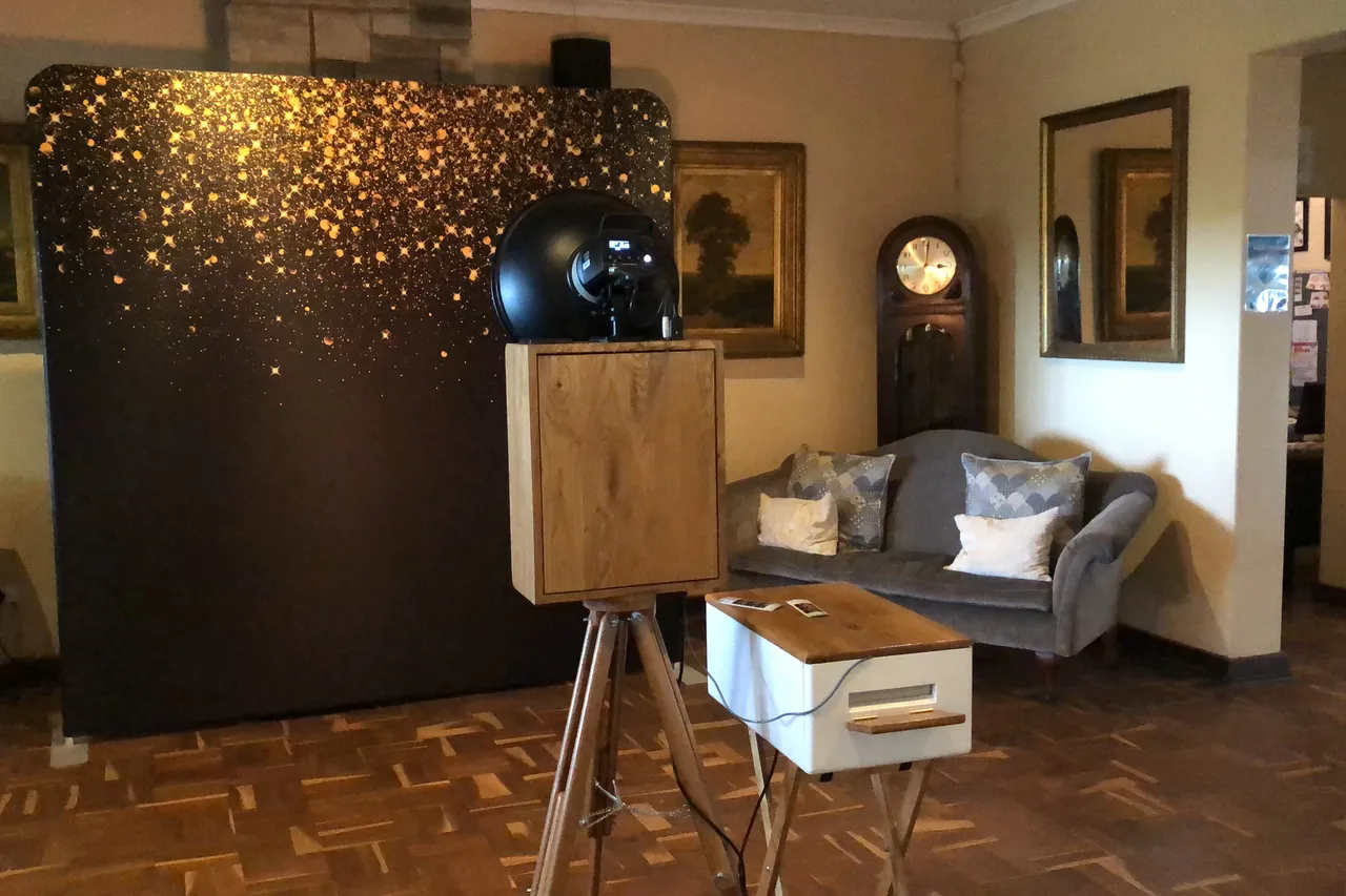 The retro photobooth and a gold-sparkle backdrop in the lounge at Collisheen Estate near Ballito