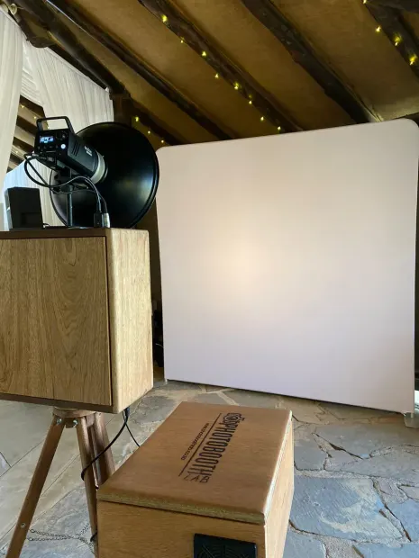 The retro photobooth beside a white backdrop under the timber roof at Collisheen