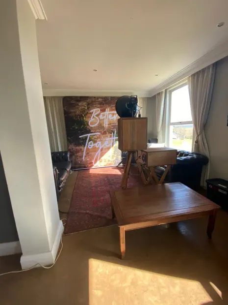 The photobooth and backdrop set up in the lounge at Fordoun beside the window