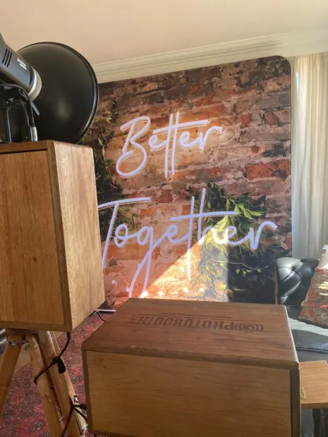 The retro photobooth and print box in front of the Better Together backdrop at Fordoun
