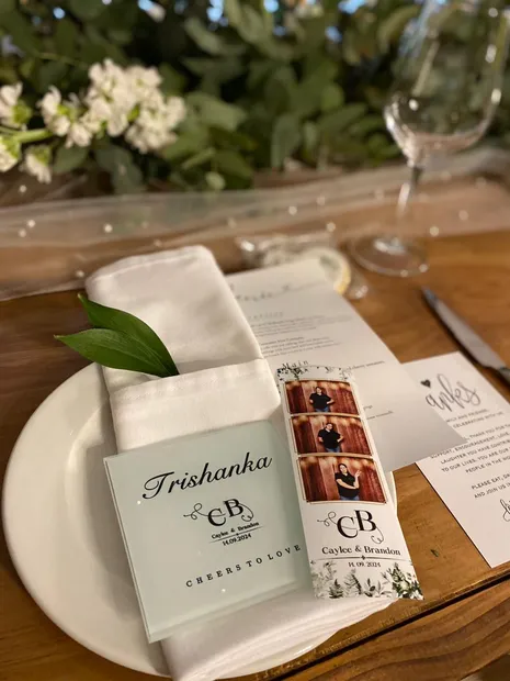 A photostrip left at a place setting on a Haycroft Farm wedding table