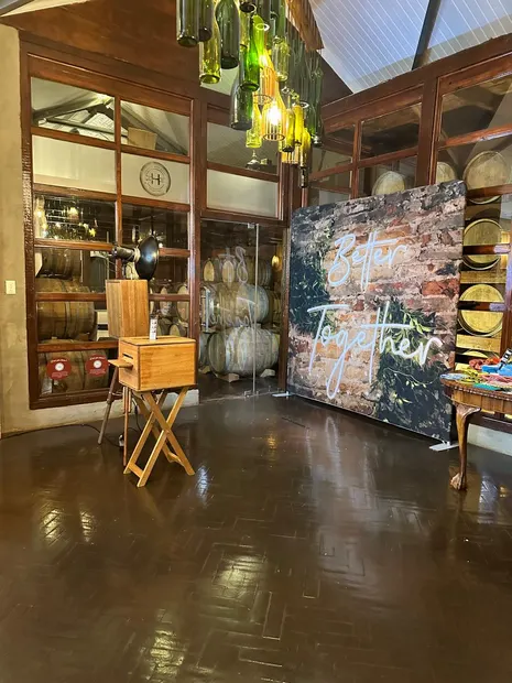 The retro photobooth beside a Better Together backdrop in the barrel room at Highgate Wine Estate