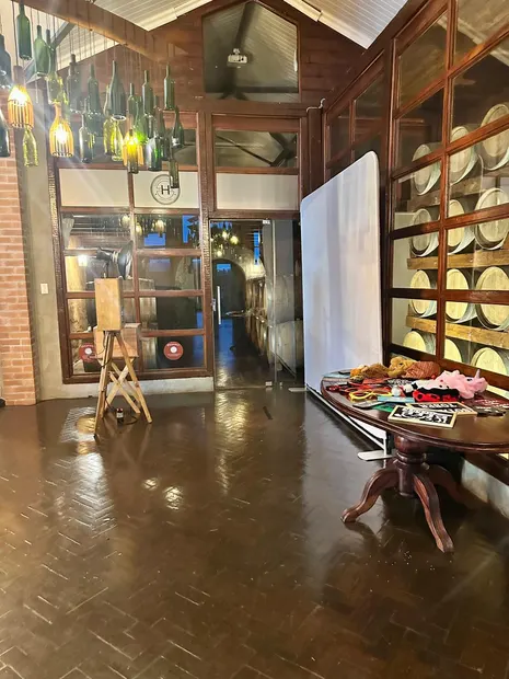 The photobooth and props table among the wine barrels at Highgate Wine Estate
