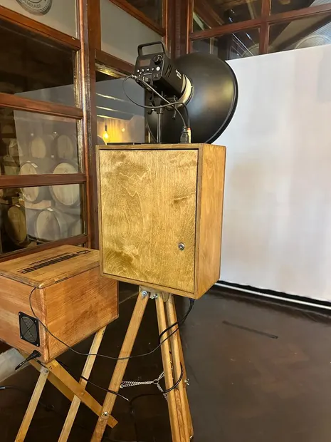 The retro photobooth and a white backdrop in the barrel room at Highgate Wine Estate