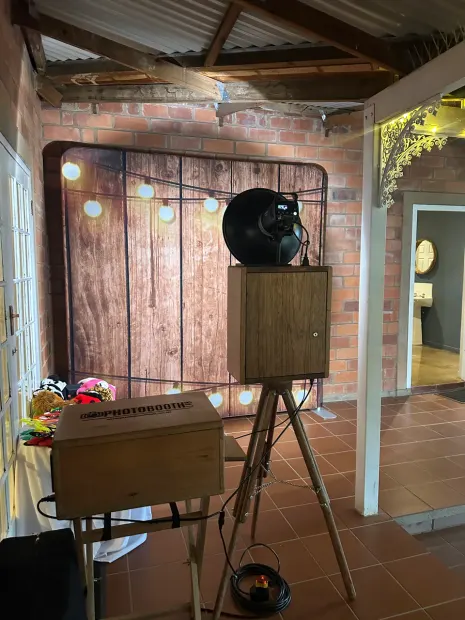The photobooth under the timber ceiling at Providence with the props basket beside it