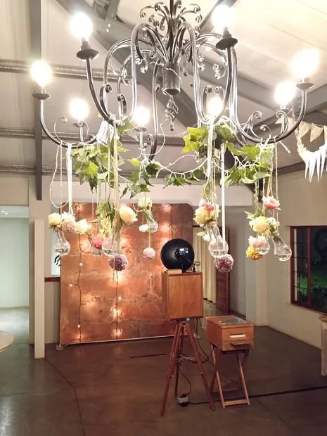 The photobooth beneath the flower-hung chandelier at Sweet Home, Eston