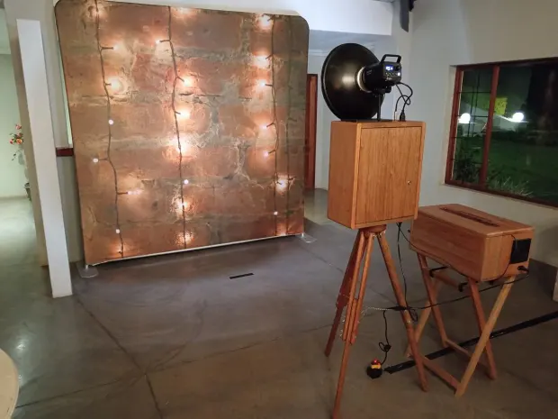 The photobooth and a copper backdrop strung with festoon lights at Sweet Home