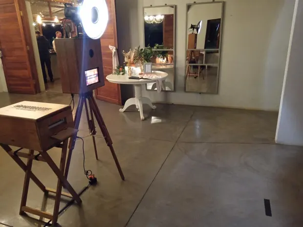 The photobooth and ring light set up beside the mirrors in the foyer at Sweet Home