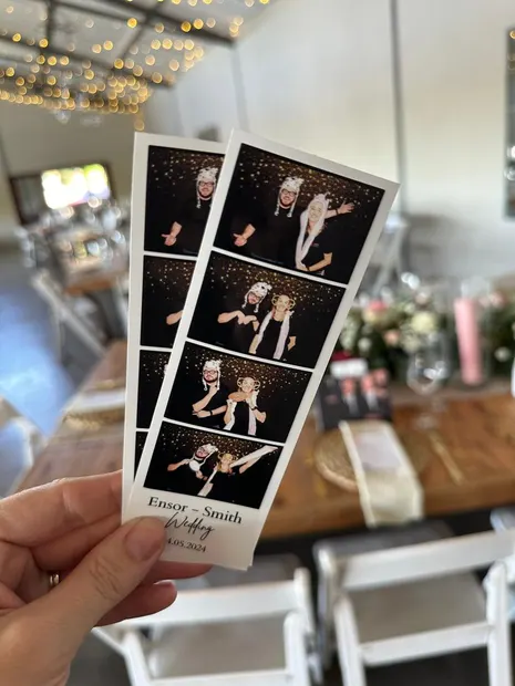 Photostrips held up beside the ceremony chairs at a Sweet Home wedding