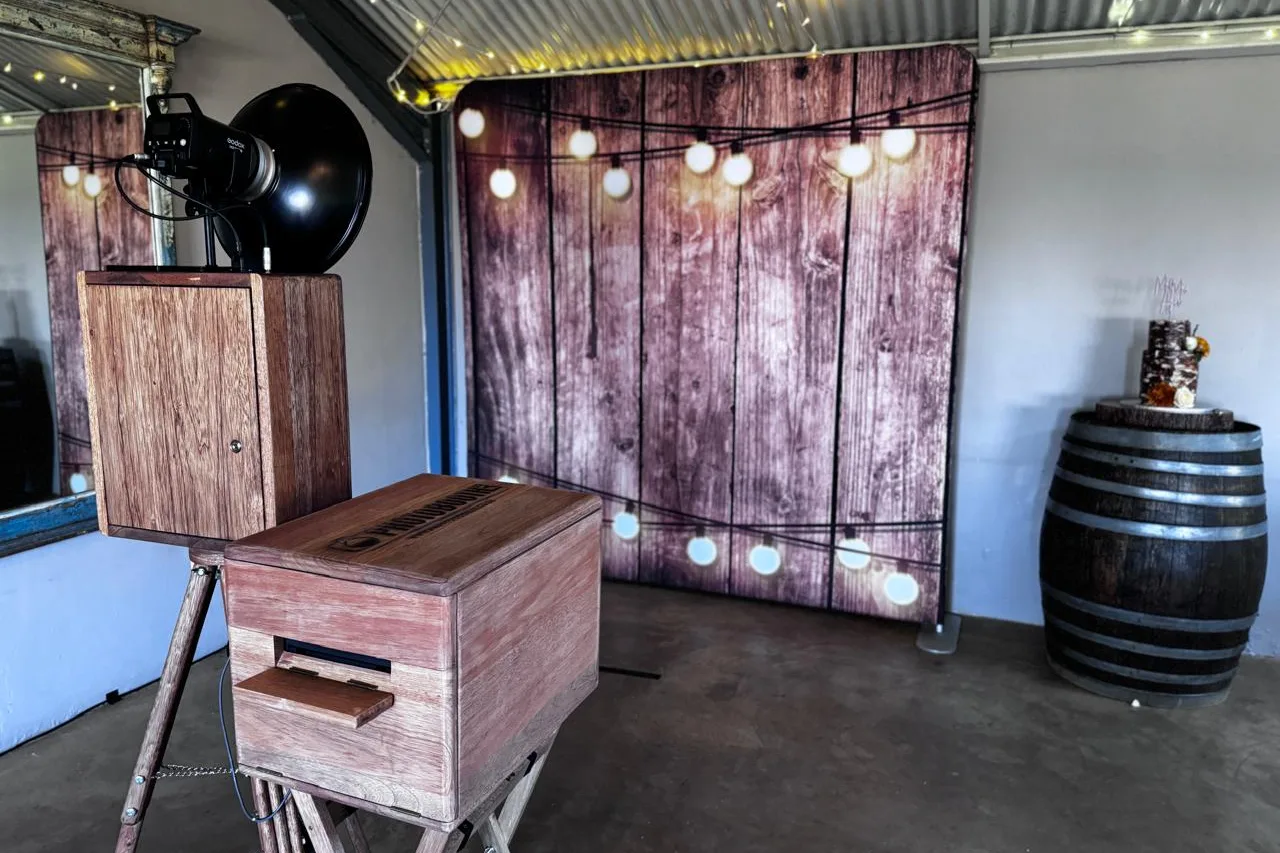 The photobooth against the festoon-lit timber backdrop in the barn at The Glades Farm, Balgowan