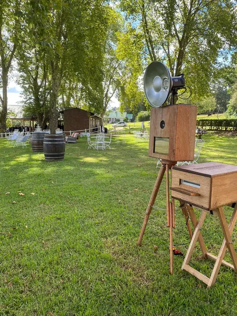 The photobooth under the poplars beside the wine barrels at The Glades Farm