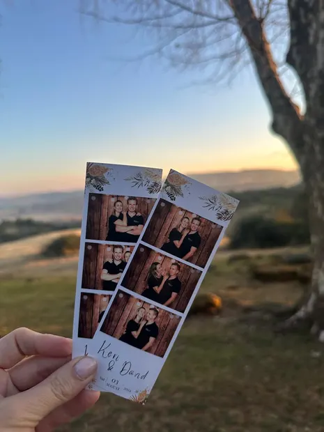 Photostrips held up at sunset over the hills at The Glades Farm