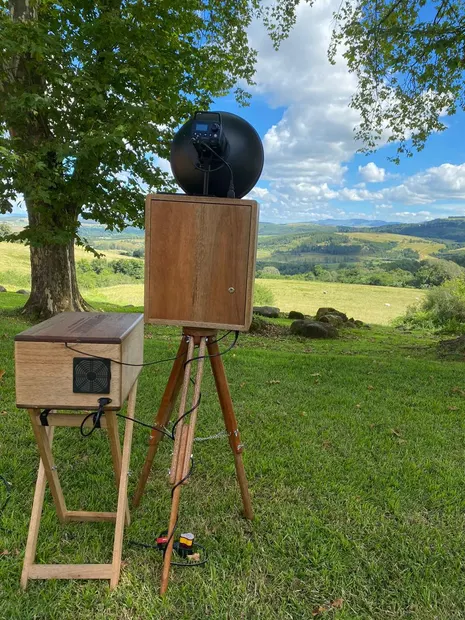 The retro photobooth set up on the lawn at The Glades Farm with the Midlands valley behind