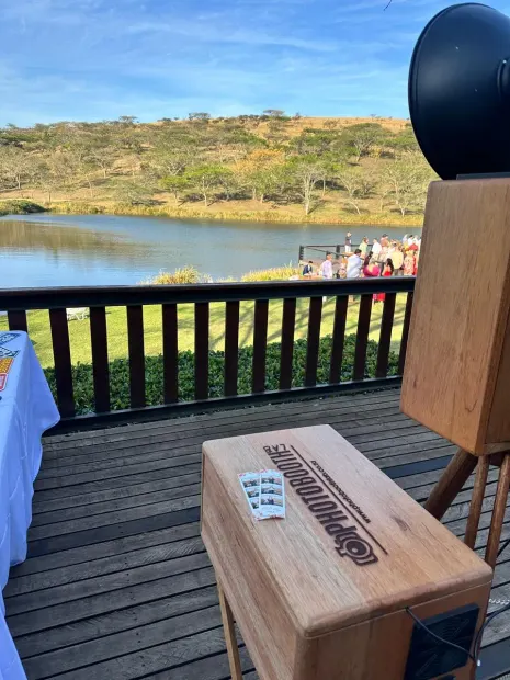 The photobooth on the deck at Wingrove Valley overlooking the lake and the ceremony