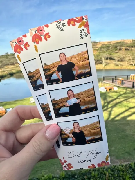 A printed photostrip held up over the dam at Wingrove Valley